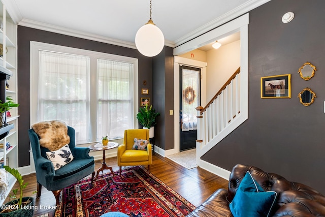 living room featuring ornamental molding and hardwood / wood-style flooring