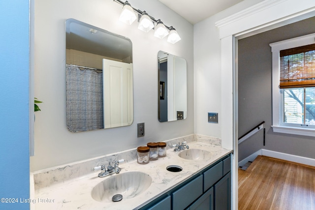 bathroom with vanity and hardwood / wood-style flooring