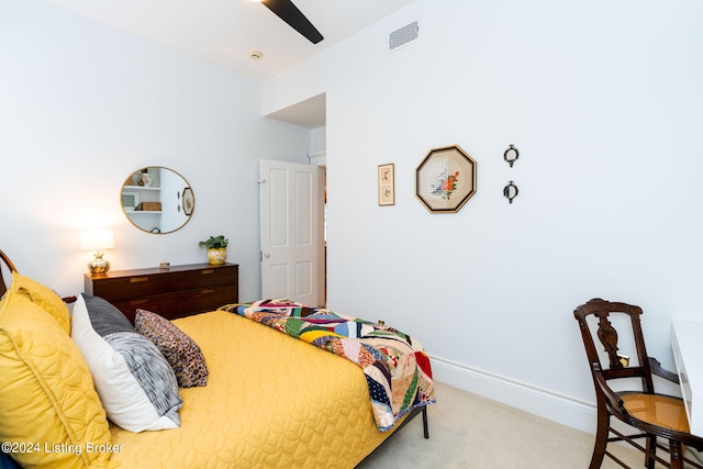 bedroom featuring ceiling fan and light carpet