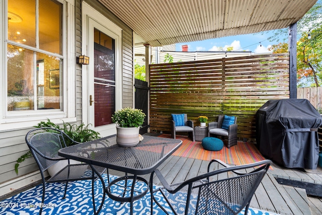 wooden terrace with grilling area