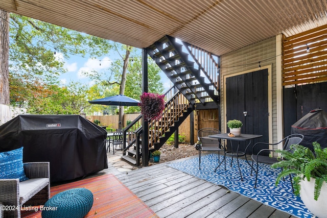 wooden deck featuring grilling area