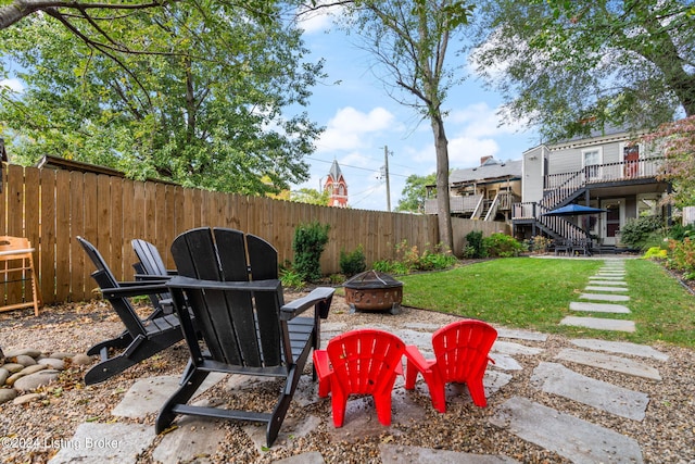 view of patio with a fire pit