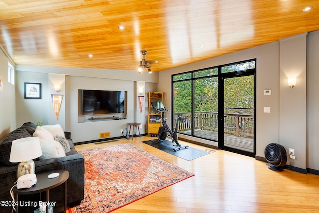 living room with wood ceiling, vaulted ceiling, and light hardwood / wood-style floors