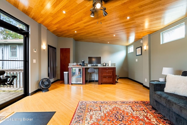 office area featuring light hardwood / wood-style floors, wood ceiling, and wine cooler