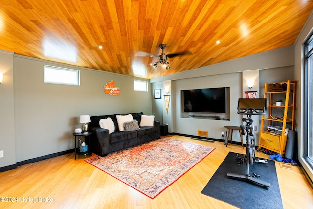 workout area featuring plenty of natural light, hardwood / wood-style flooring, ceiling fan, and wood ceiling