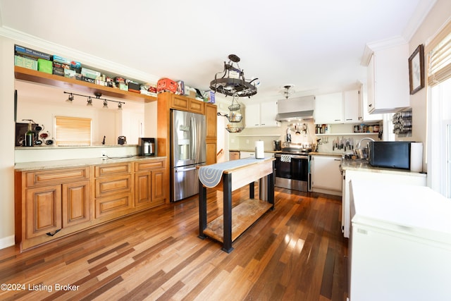 kitchen with crown molding, stainless steel appliances, exhaust hood, white cabinets, and dark wood-type flooring