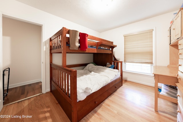 bedroom with light wood-type flooring