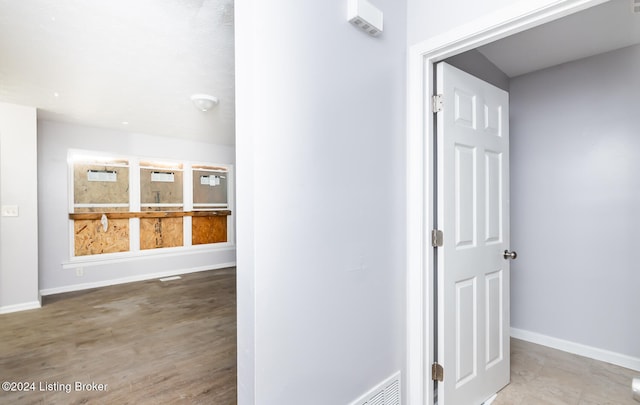 hallway featuring hardwood / wood-style flooring