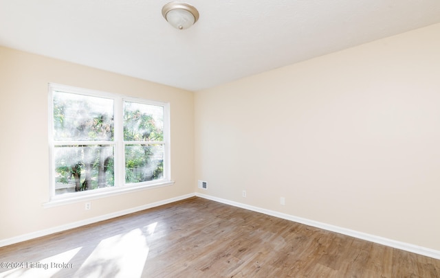 spare room with light wood-type flooring