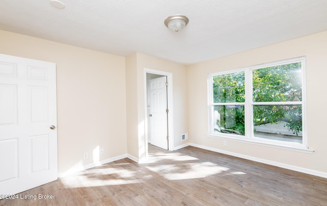 unfurnished bedroom featuring hardwood / wood-style flooring