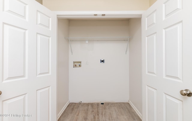 laundry area featuring washer hookup, electric dryer hookup, and light hardwood / wood-style floors