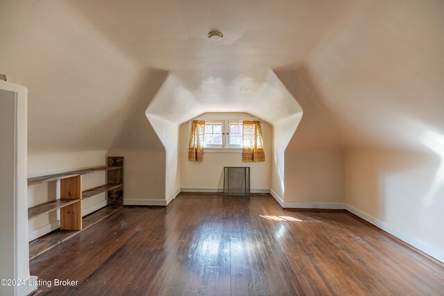 bonus room featuring lofted ceiling and dark wood-type flooring