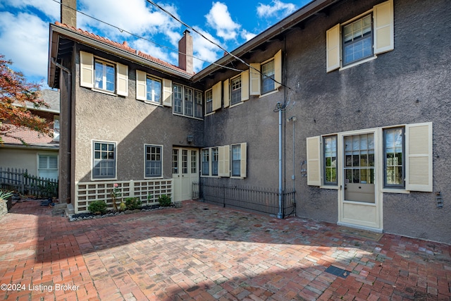 back of property featuring a patio area