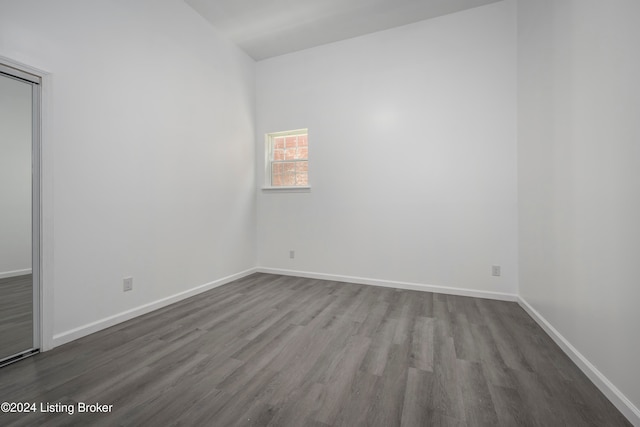 unfurnished room with hardwood / wood-style flooring