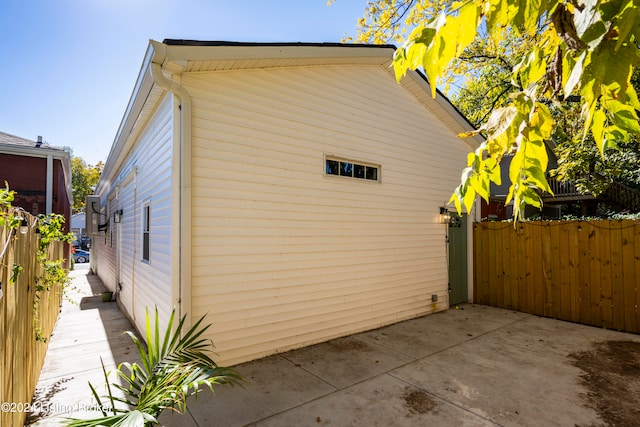 view of side of home featuring a patio