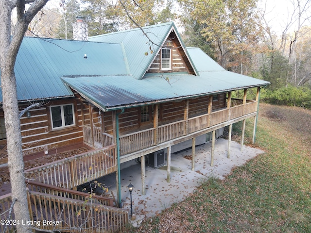 back of property with a patio