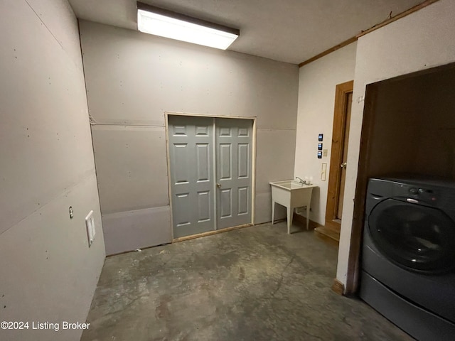 washroom featuring sink and washer / clothes dryer