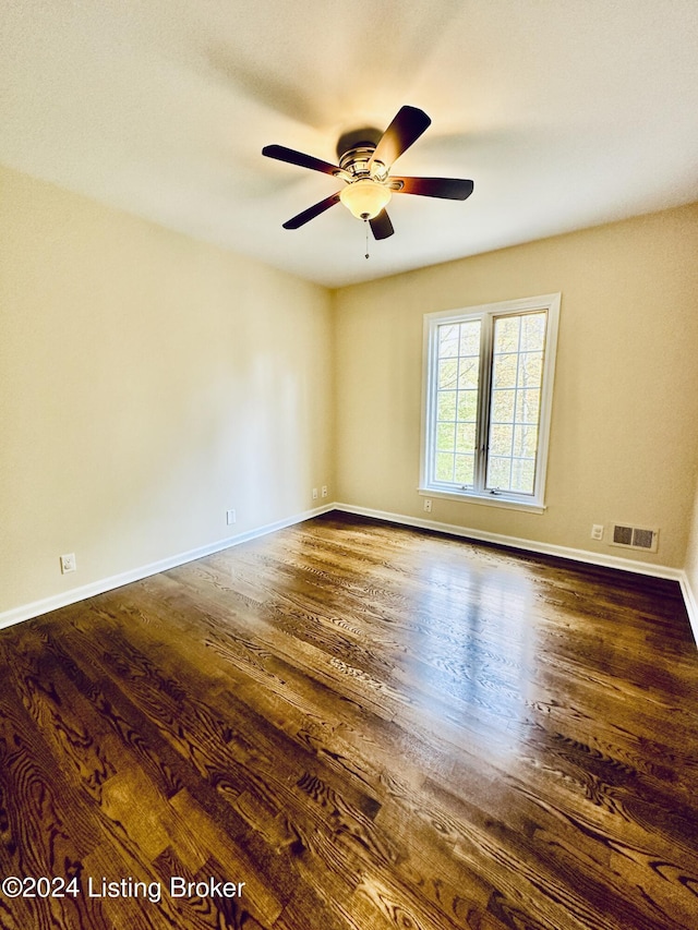 spare room with ceiling fan and hardwood / wood-style flooring