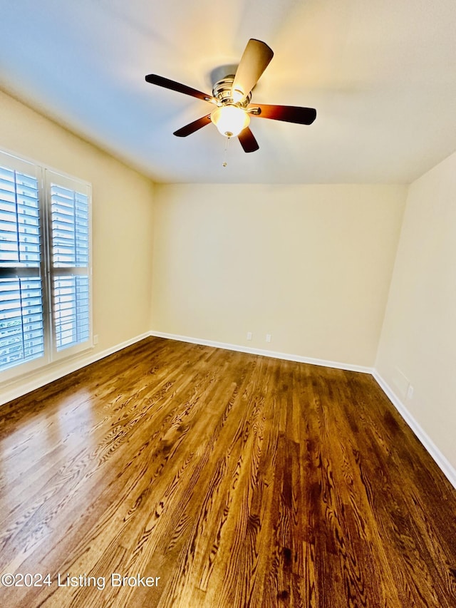 unfurnished room with hardwood / wood-style floors and ceiling fan