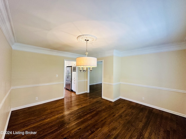 unfurnished dining area featuring dark hardwood / wood-style flooring and ornamental molding