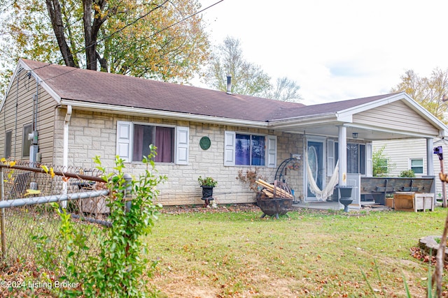 ranch-style home with a front yard