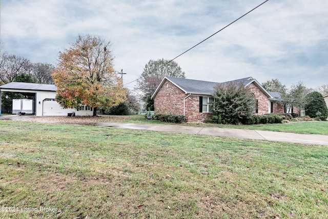 exterior space with a garage and a lawn