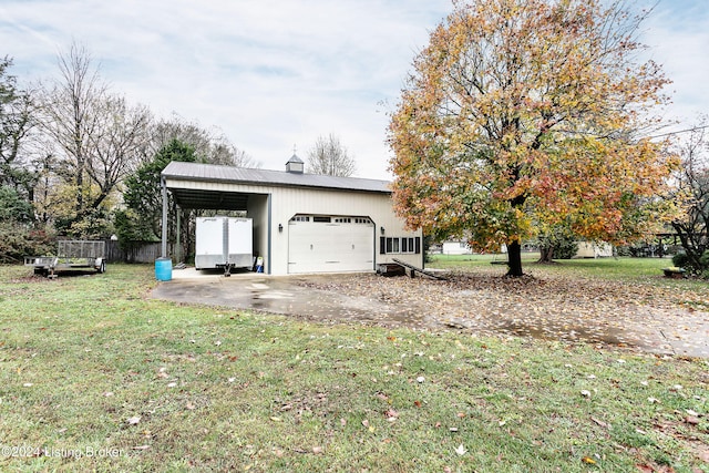 garage with a yard and a carport