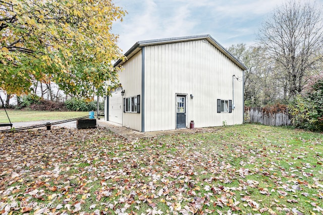 view of property exterior featuring a lawn