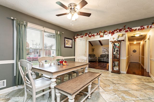 dining space featuring light wood-type flooring and ceiling fan