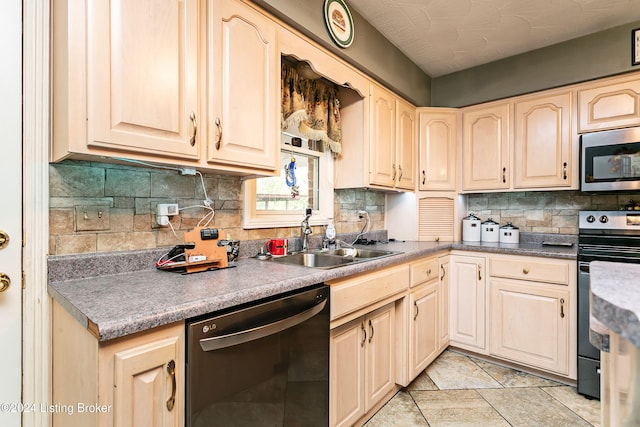 kitchen with black dishwasher, decorative backsplash, sink, oven, and range with electric stovetop