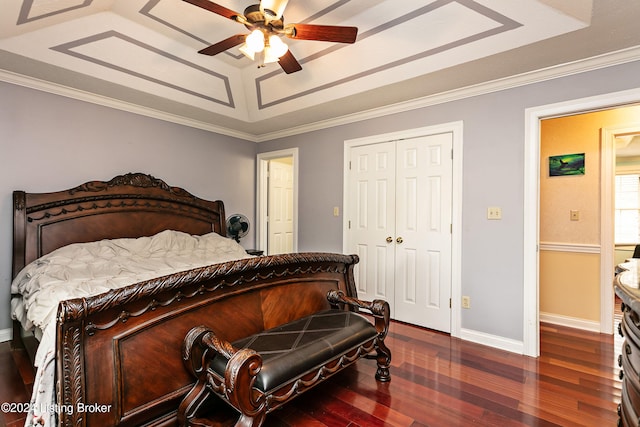 bedroom with dark wood-type flooring, ornamental molding, and ceiling fan