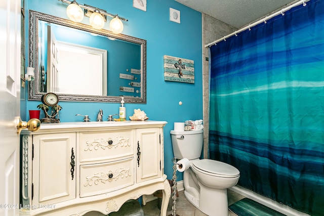 bathroom with a shower with curtain, a textured ceiling, vanity, tile patterned floors, and toilet