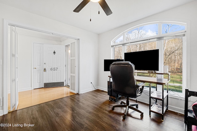 home office with dark hardwood / wood-style floors and ceiling fan