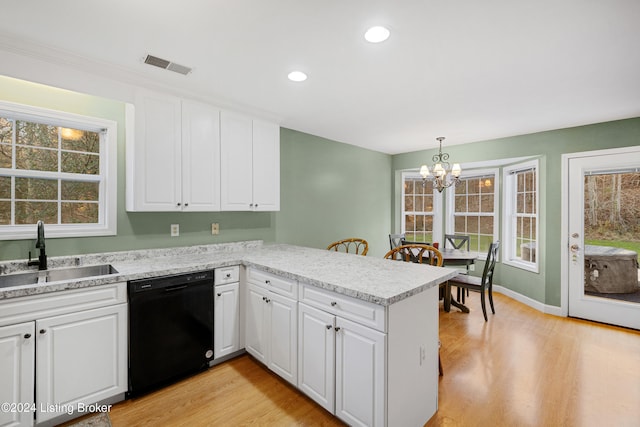 kitchen featuring kitchen peninsula, black dishwasher, and white cabinets