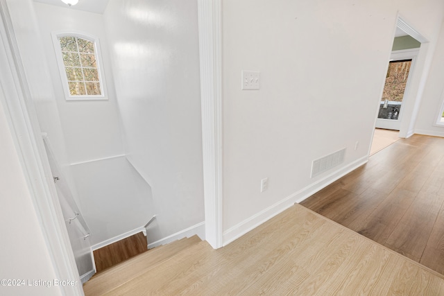 hall with light hardwood / wood-style flooring