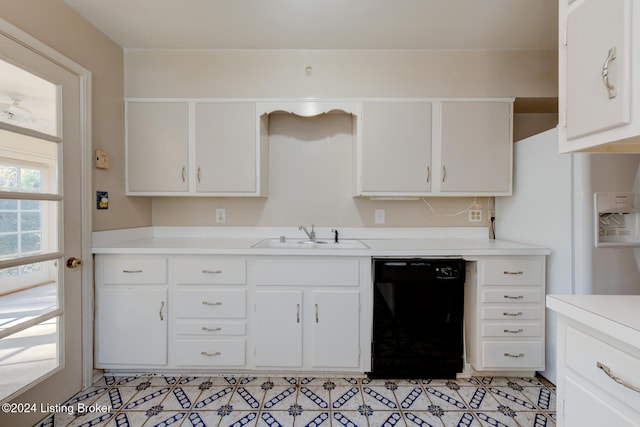 kitchen featuring dishwasher, white cabinetry, and sink