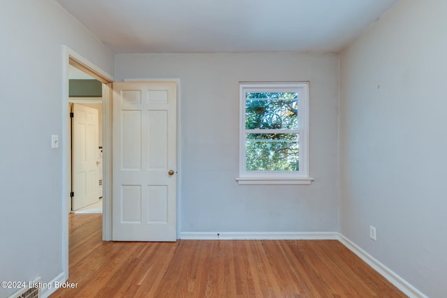 unfurnished room featuring light wood-type flooring