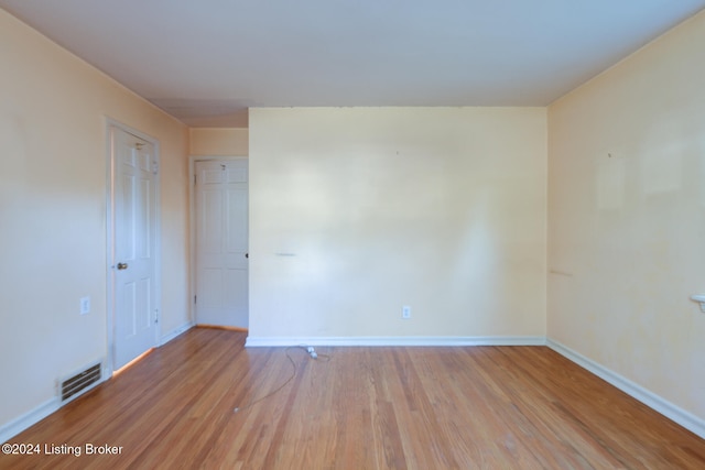 unfurnished room featuring light hardwood / wood-style flooring