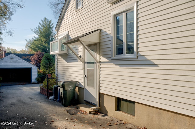 view of home's exterior featuring a garage and an outdoor structure