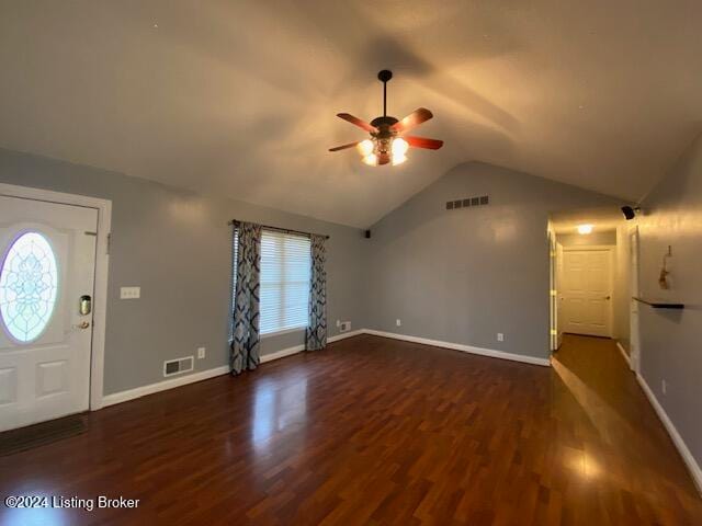 foyer with dark wood-type flooring, ceiling fan, and vaulted ceiling