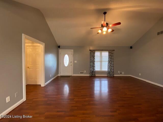 entryway with dark wood-type flooring, vaulted ceiling, and ceiling fan