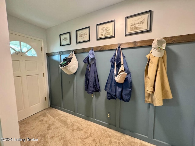 mudroom with light colored carpet