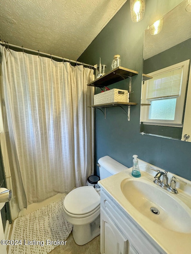 bathroom with walk in shower, tile patterned flooring, a textured ceiling, vanity, and toilet