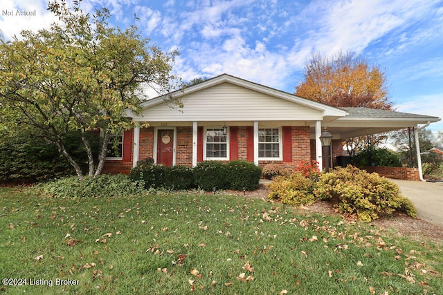 view of front of home with a carport and a front yard