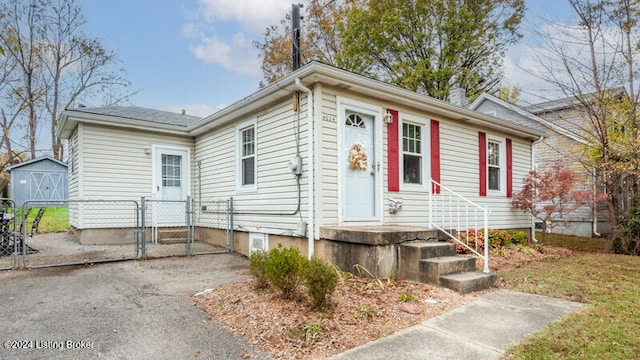 view of front of house with a shed