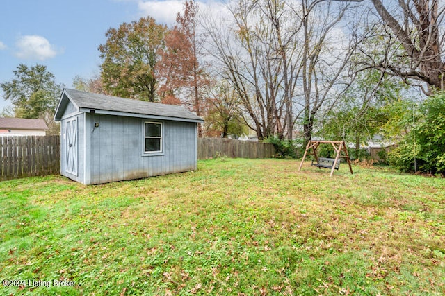 view of yard featuring a storage unit