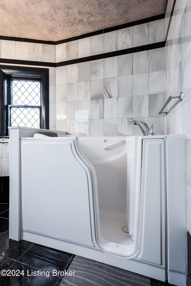 bathroom featuring tile walls and tile patterned flooring