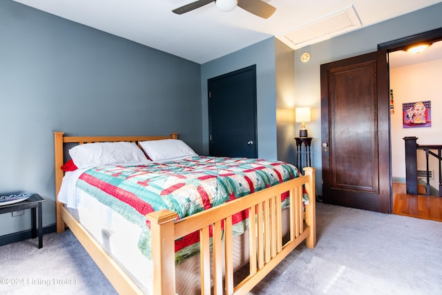 carpeted bedroom with ceiling fan