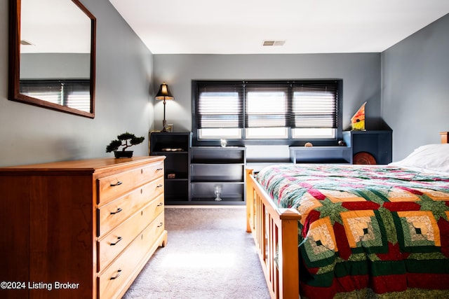 bedroom with light colored carpet