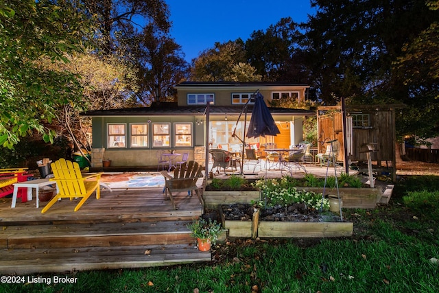 rear view of property with a deck